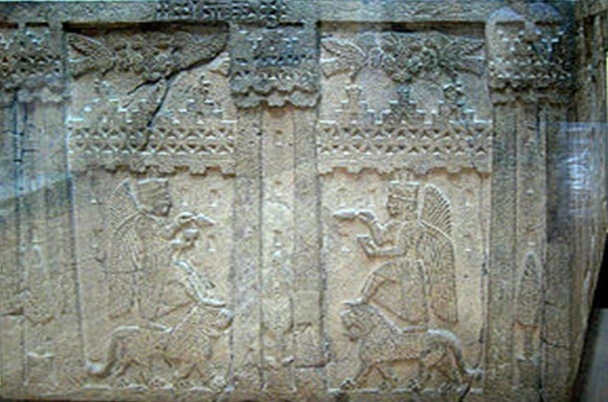 The god Khaldi stands on a lion, holding a cup in his left hand and a spearhead  in his right