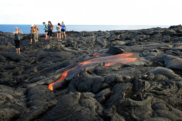 Tourists on a volcano in Hawaii