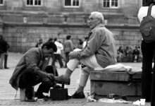 Cleaning shoes on the street in the early 20th century