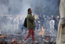 Monk walk barefoot over hot coal