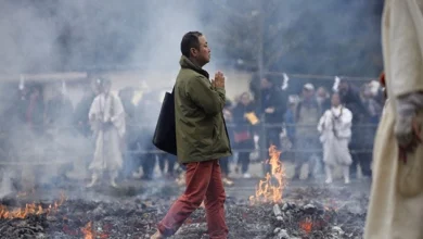 Monk walk barefoot over hot coal
